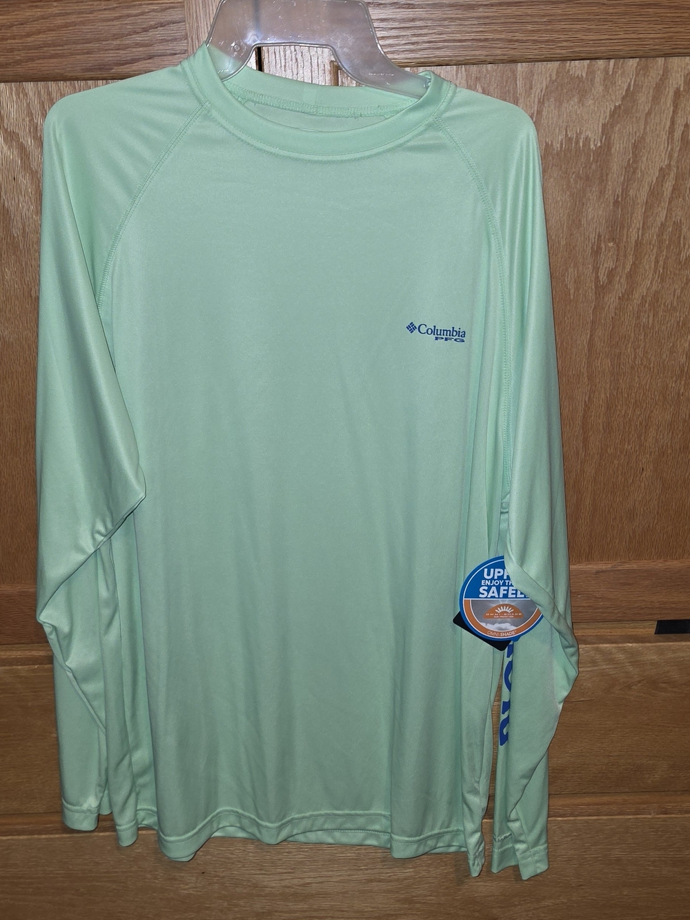 Terminal Tackle Long-Sleeve Shirt in Mint Green with Royal Blue graphics.